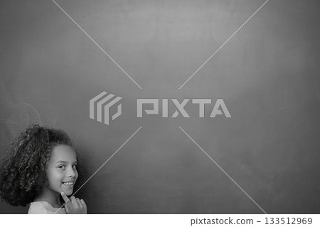 Schoolchild with blackboard 133512969