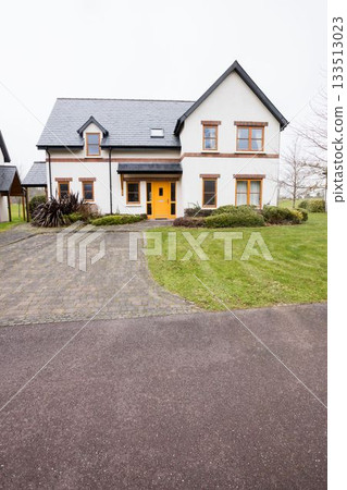 Flat design detached house sitting in yard, featuring steep gray roof, yellow door, driveway, lawn Flat design detached house sitting in yard, featuring steep gray roof, yellow door, driveway, lawn 133513023