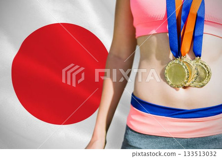 Midsection of medalist against Japanese Flag 133513032