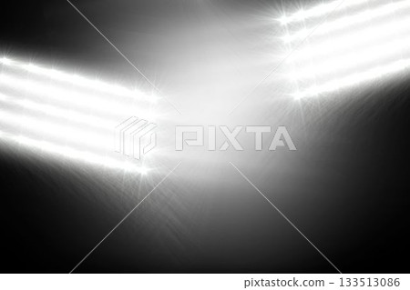 Two floodlight panels are shining in flat design on dark gradient backdrop, with starburst effect 133513086