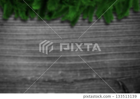 Blurred fir branches on wood Blurred fir branches on wood 133513139
