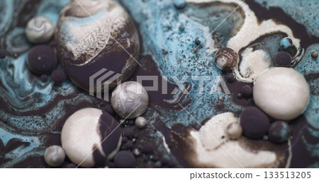 Ink bubble particles. Paint water. Defocused blue white purple color glitter oil round liquid floating on abstract bokeh background. 133513205