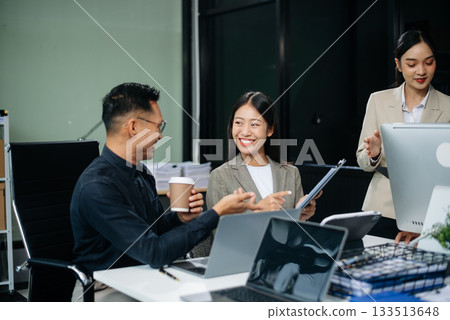 Group of Asian business meeting in planning design in creative business discussing work Group of Asian business meeting in planning design in creative business discussing work 133513648