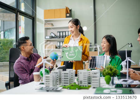 Asian professionals collaborate on sustainable energy solutions with wind turbines, solar panels, and eco friendly models Asian professionals collaborate on sustainable energy solutions with wind turbines, solar panels, and eco friendly models 133513670