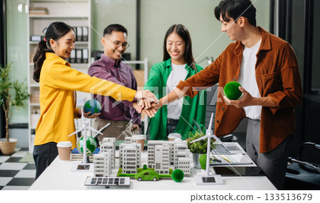 Sustainable innovation by young professionals for a greener future. Showcasing renewable energy solutions with solar panels, wind Sustainable innovation by young professionals for a greener future. Showcasing renewable energy solutions with solar panels, wind 133513679