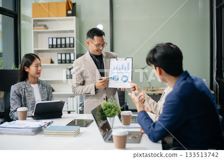 Business teamwork and collaboration among Asian professionals in a modern office 133513742