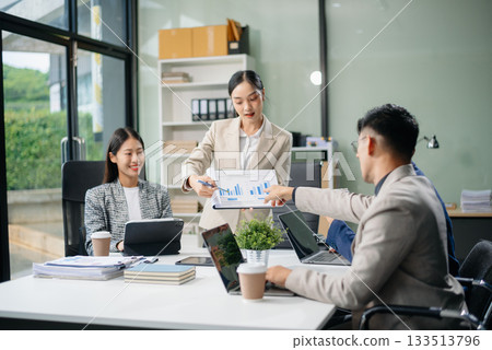 Group of Asian business meeting in planning design in creative business discussing work 133513796