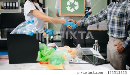 Eco-friendly teamwork with this office recycling scene. Perfect for showcasing sustainability, collaboration, 133513833