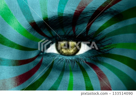 Green eye on patterned face Green eye on patterned face 133514090