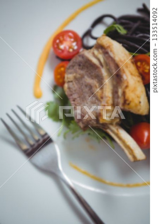 High angle view of lamb chop in plate 133514092