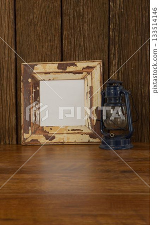 Photo frame and lantern on table Photo frame and lantern on table 133514146