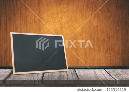 Black board on a wooden table 133514219