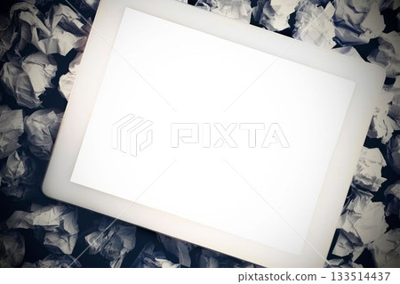 Tablet pc on crumpled paper Tablet pc on crumpled paper 133514437