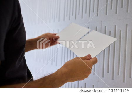 Joyful homeowner redesigns textured wall effortlessly, Homeowner happily personalizes textured wall with self installed decorative mirror tiles for stylish appeal 133515109