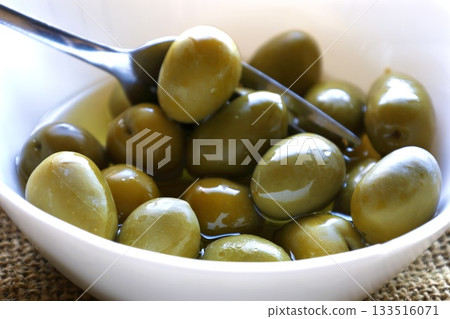 Fresh Green Olives in White Bowl 133516071