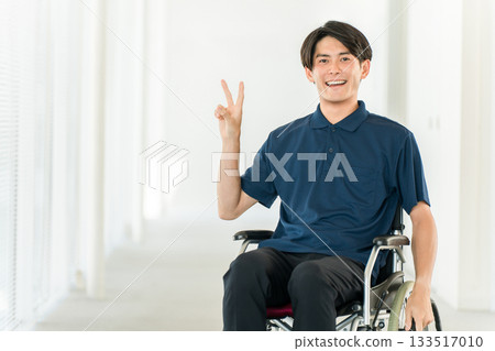 Young Asian man in a wheelchair (handicap, barrier-free, charity, care, welfare) Young Asian man in a wheelchair (handicap, barrier-free, charity, care, welfare) 133517010