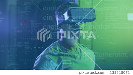 African American man wearing VR headset exploring scene in green blue studio, with floating code African American man wearing VR headset exploring scene in green blue studio, with floating code 133518071