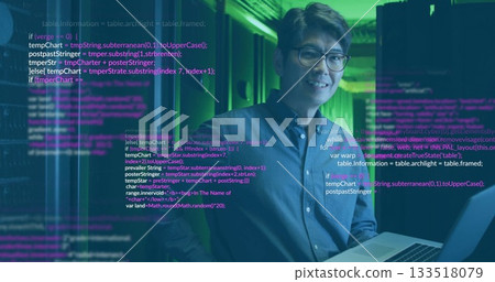 Standing Korean man holding laptop inside server room, with server racks and overlaid code text Standing Korean man holding laptop inside server room, with server racks and overlaid code text 133518079