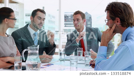 Discussing four professionals gesturing around office glass-top table with documents, water pitcher Discussing four professionals gesturing around office glass-top table with documents, water pitcher 133518874