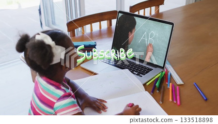 Watching girl studying AB letters with tutor on laptop at dining table, with notebook, copy space Watching girl studying AB letters with tutor on laptop at dining table, with notebook, copy space 133518898