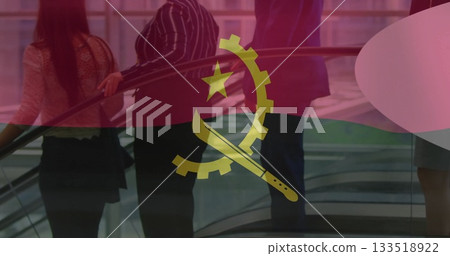 Group of adults wearing business attire ascending on moving escalator in atrium, with flag overlay Group of adults wearing business attire ascending on moving escalator in atrium, with flag overlay 133518922
