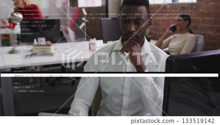 Focusing man wearing white shirt coding at open plan office, with coffee mug and smartphone Focusing man wearing white shirt coding at open plan office, with coffee mug and smartphone 133519142