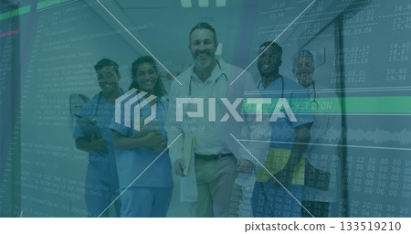 Standing physician in white coat holding patient files in corridor with nurses and code overlay 133519210