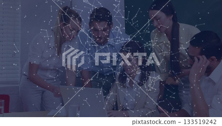 Collaborating professionals gathering around laptop and coffee in conference room, network overlay 133519242