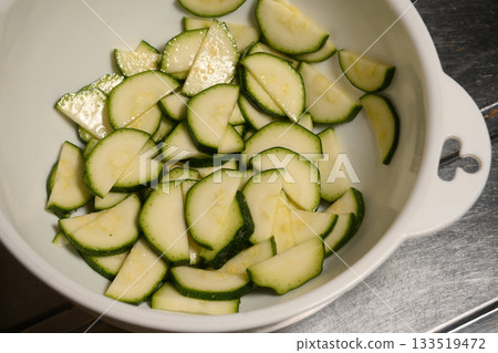 Sliced and salted zucchini 133519472