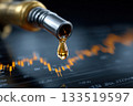Drops of golden liquid flow from a fuel dispenser gun against the background of stock market charts 133519597