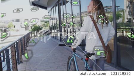 Walking male wearing jacket, pushing blue bicycle near glass windows, with eco icons, copy space Walking male wearing jacket, pushing blue bicycle near glass windows, with eco icons, copy space 133519825
