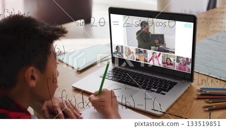 Attending online lesson, Asian boy solving math at home desk with laptop, green pencil, copy space Attending online lesson, Asian boy solving math at home desk with laptop, green pencil, copy space 133519851