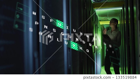 Technician in shirt and slacks inspecting server racks in data center, with hologram, copy space 133519884