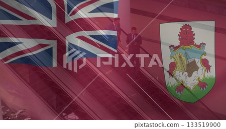 Riding escalator businessmen in dark suits using smartphone and tablet in office lobby 133519900