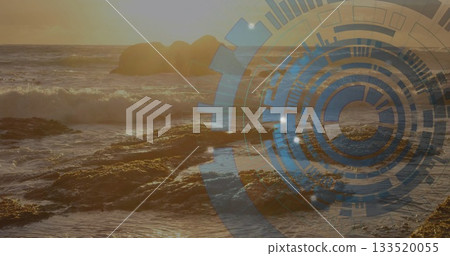 Crashing sunlit ocean waves hitting jagged rocky shoreline at sunset, with digital HUD graphic Crashing sunlit ocean waves hitting jagged rocky shoreline at sunset, with digital HUD graphic 133520055