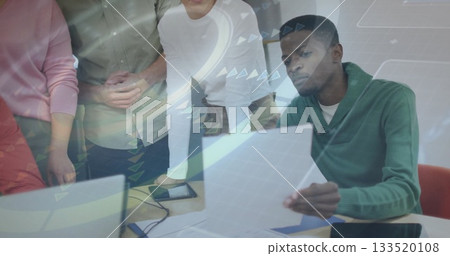 Analyzing printed documents and digital displays by professionals at conference table, copy space Analyzing printed documents and digital displays by professionals at conference table, copy space 133520108