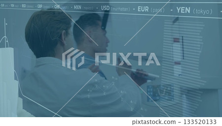 Two financial professionals interpreting currency rates on digital display with stylus in office Two financial professionals interpreting currency rates on digital display with stylus in office 133520133