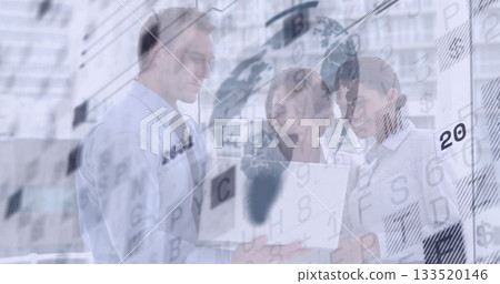 Reviewing three business professionals analyzing global data in modern office with laptop overlays Reviewing three business professionals analyzing global data in modern office with laptop overlays 133520146