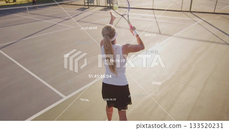 Serving female tennis player holding racket overhead on outdoor court, with floating timestamps Serving female tennis player holding racket overhead on outdoor court, with floating timestamps 133520231