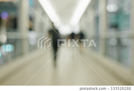 Blurred view of corridor with people walking abtract background 133520288