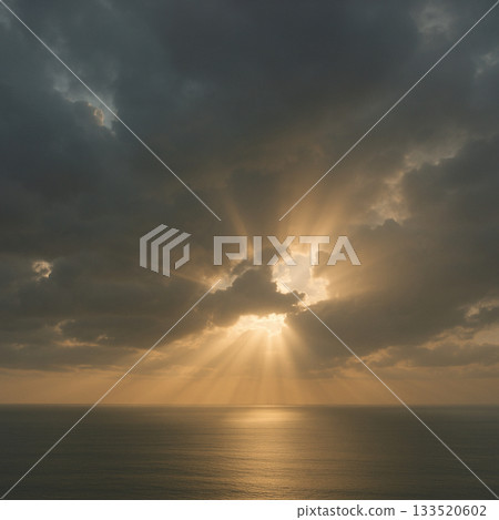 A calm sea with golden light filtering through the clouds A calm sea with golden light filtering through the clouds 133520602