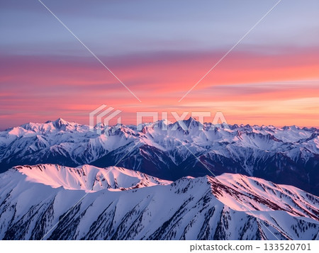 Majestic Snow-Capped Mountains at Dawn's Radiant Glow 133520701