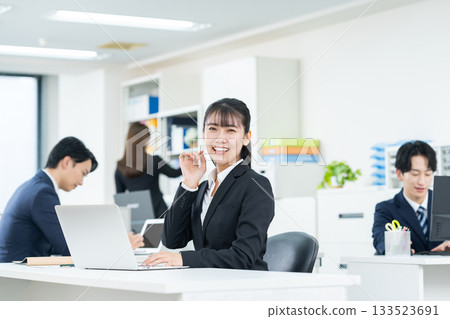 Young business woman working in the office Young business woman working in the office 133523691