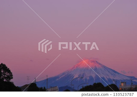 Mount Fuji shining in the setting sun from a service area on the Tomei Expressway Mount Fuji shining in the setting sun from a service area on the Tomei Expressway 133523787