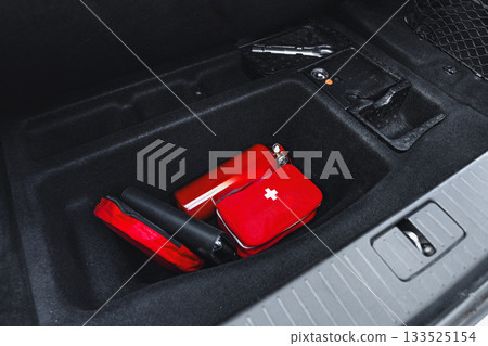 Essential items stored in the trunk of a vehicle for emergency situations Essential items stored in the trunk of a vehicle for emergency situations 133525154