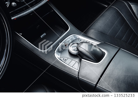 Modern car interior with detailed gear shift and control buttons Modern car interior with detailed gear shift and control buttons 133525233