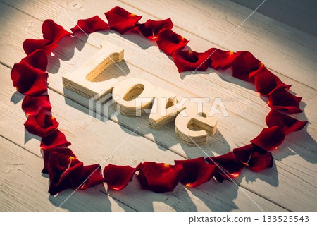 Heart shape frame with red roses petals Heart shape frame with red roses petals 133525543