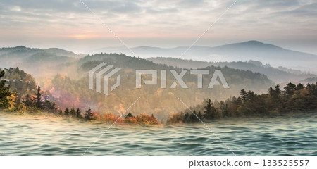 Scenic view of sea against mountains during sunset Scenic view of sea against mountains during sunset 133525557