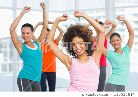 Fitness class is happening in flat design studio with city skyline windows and colorful attire Fitness class is happening in flat design studio with city skyline windows and colorful attire 133525614