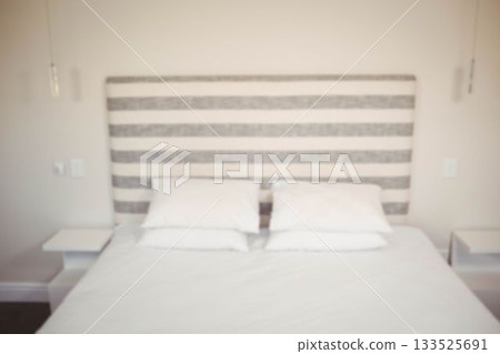 Arranged bed in bedroom at home Arranged bed in bedroom at home 133525691